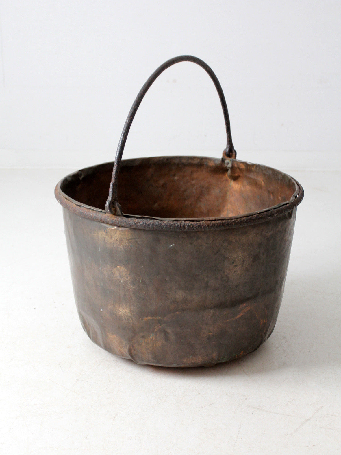 antique copper pot with iron handle