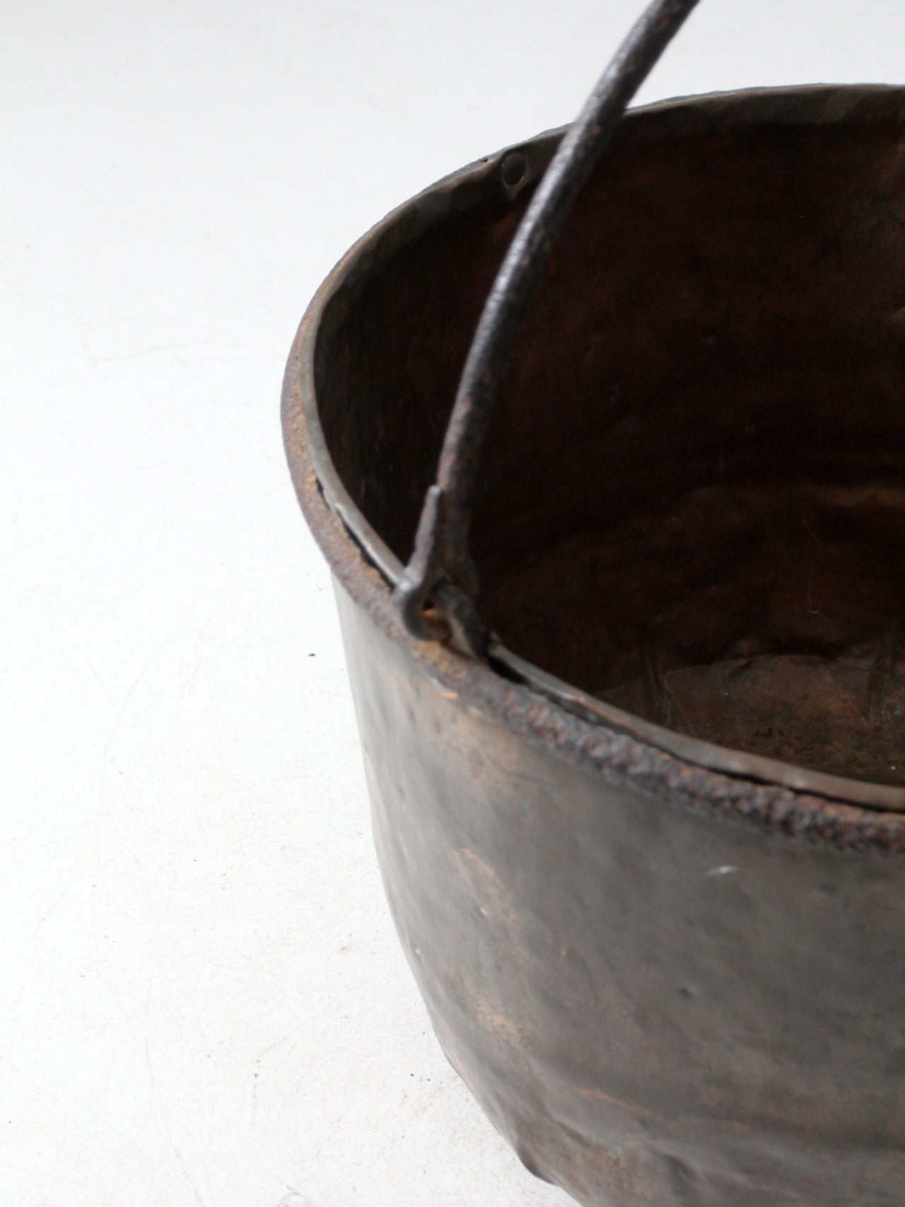antique copper pot with iron handle