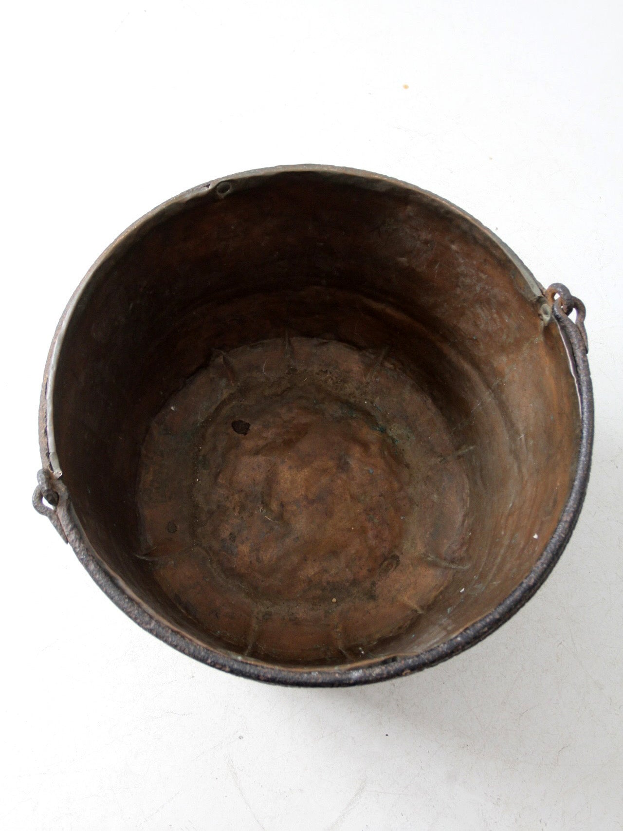 antique copper pot with iron handle