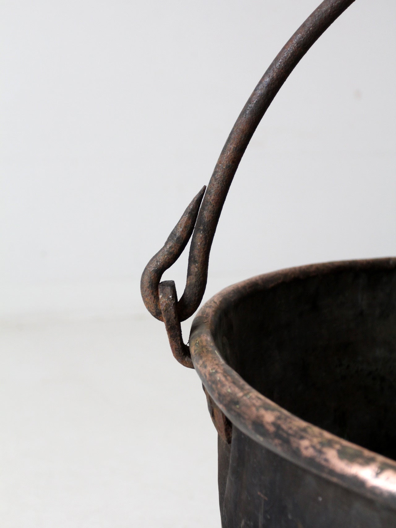 antique copper pot with iron handle