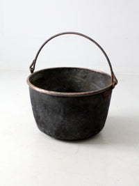 antique copper pot with iron handle