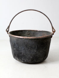 antique copper pot with iron handle