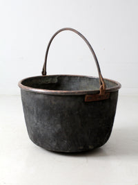 antique copper pot with iron handle