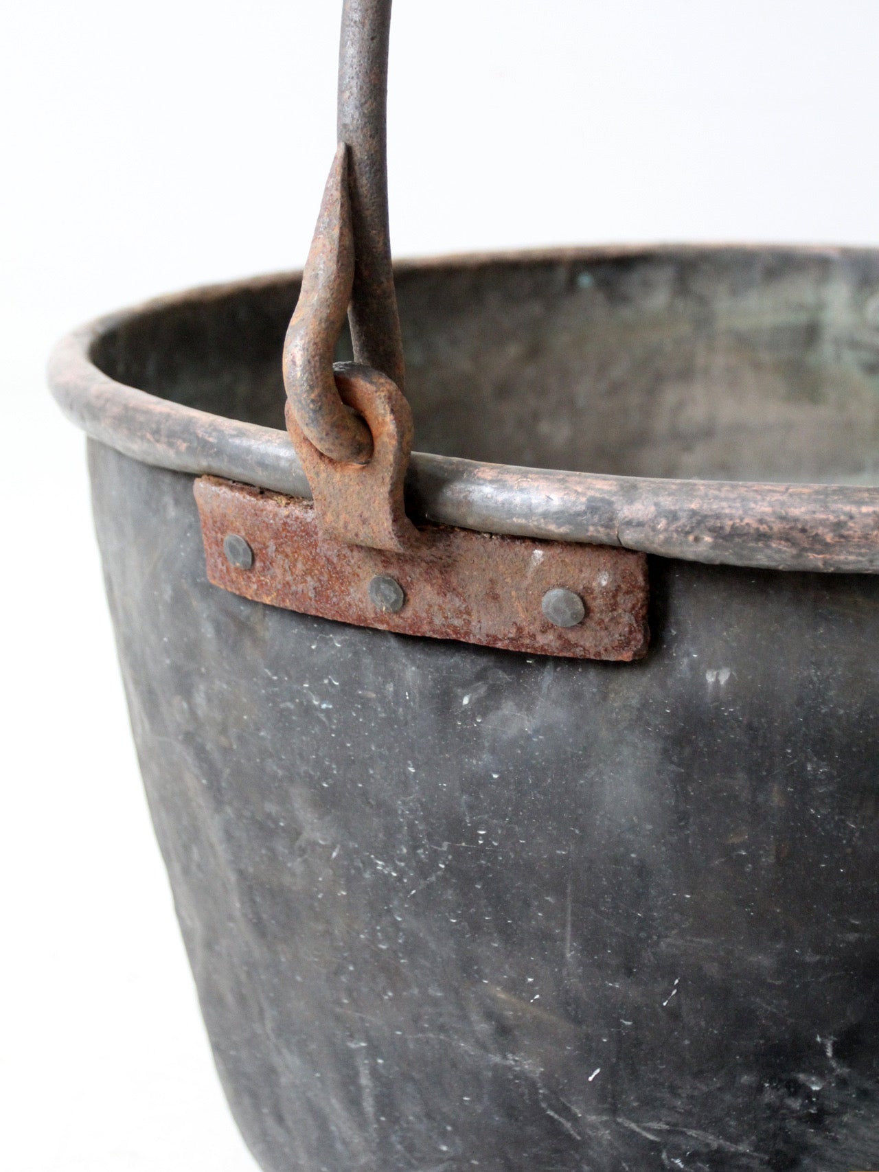 antique copper pot with iron handle