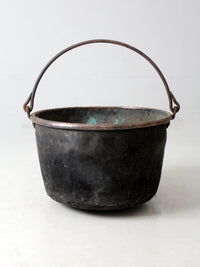 antique copper pot with iron handle