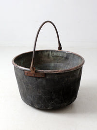 antique copper pot with iron handle
