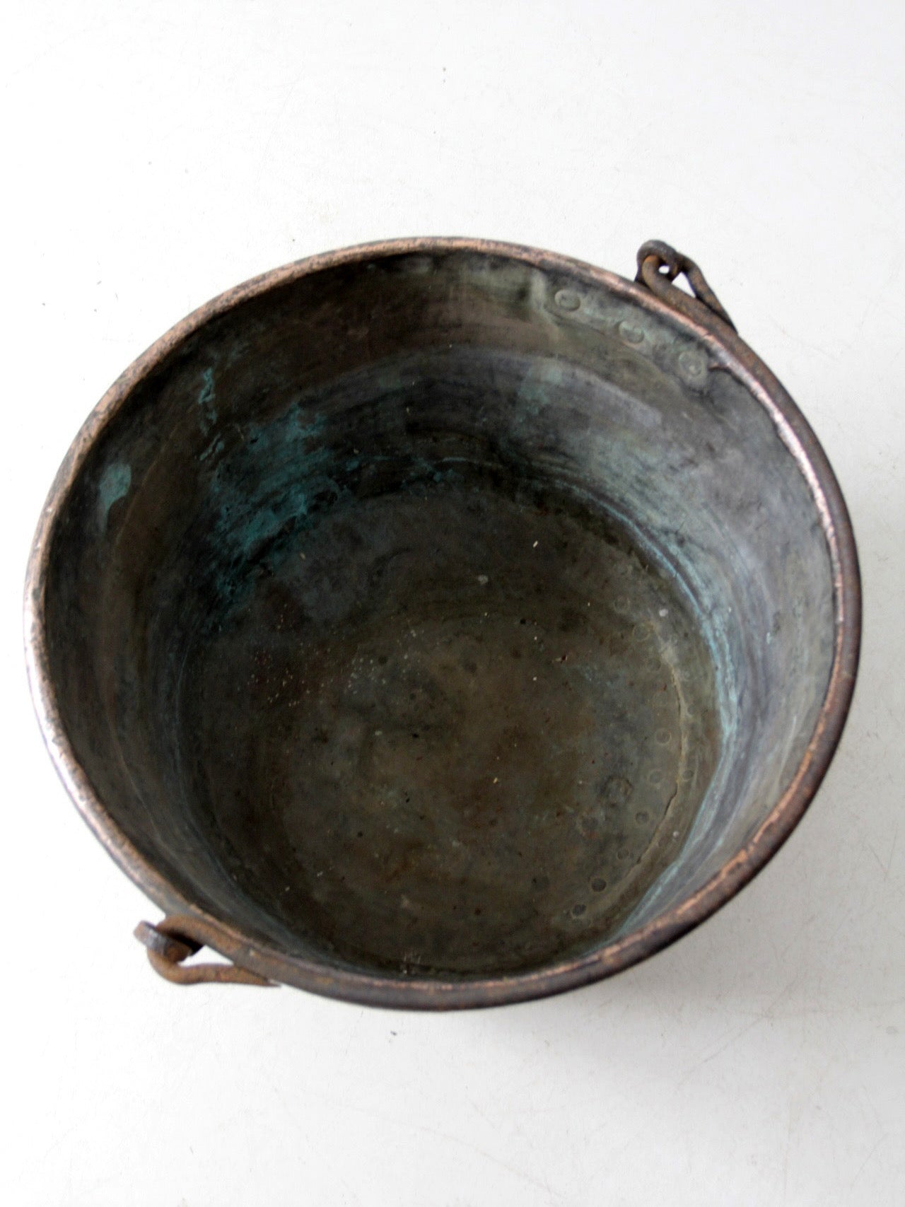 antique copper pot with iron handle