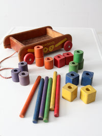 vintage 50s Playskool toy wagon with blocks