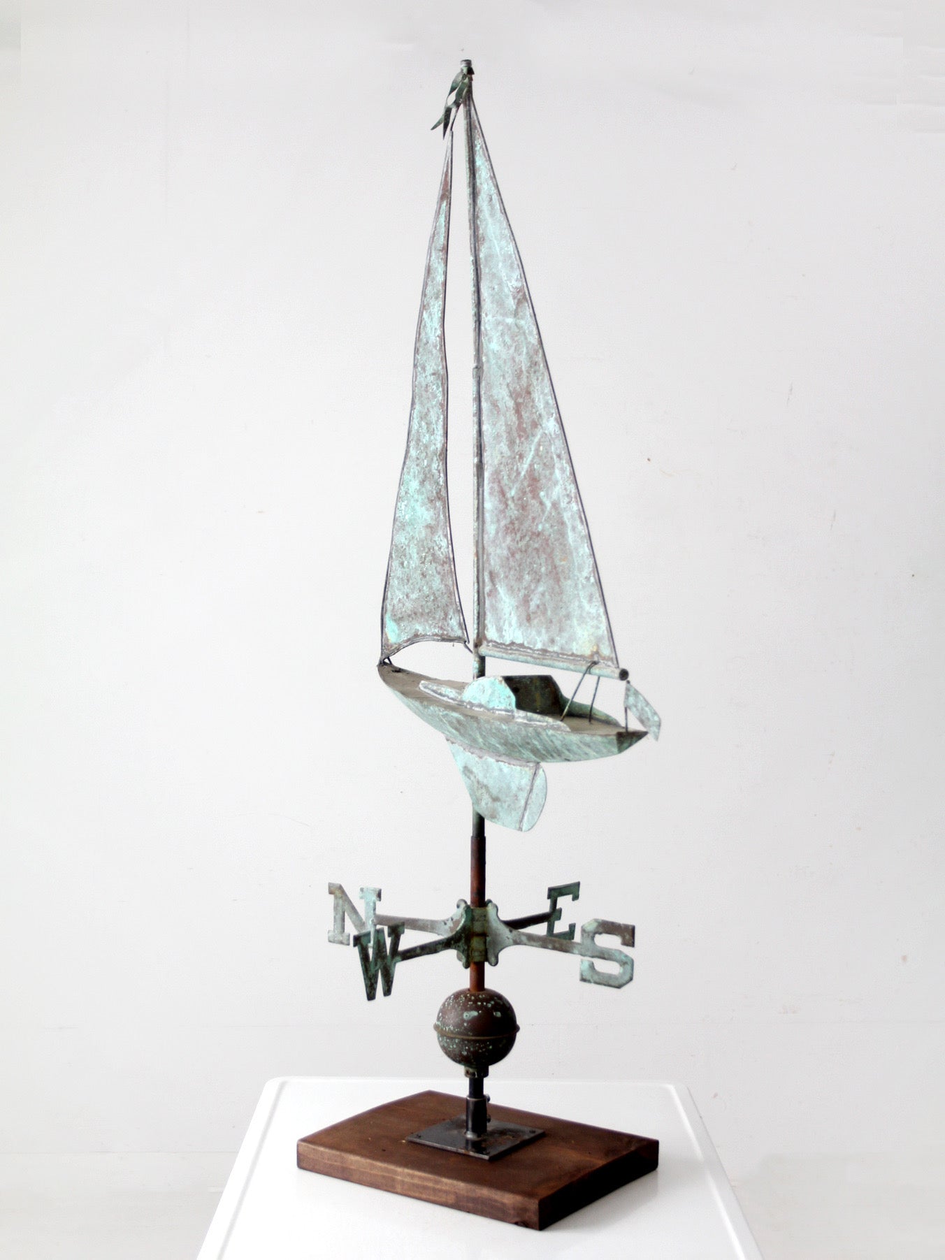 antique nautical weathervane on stand