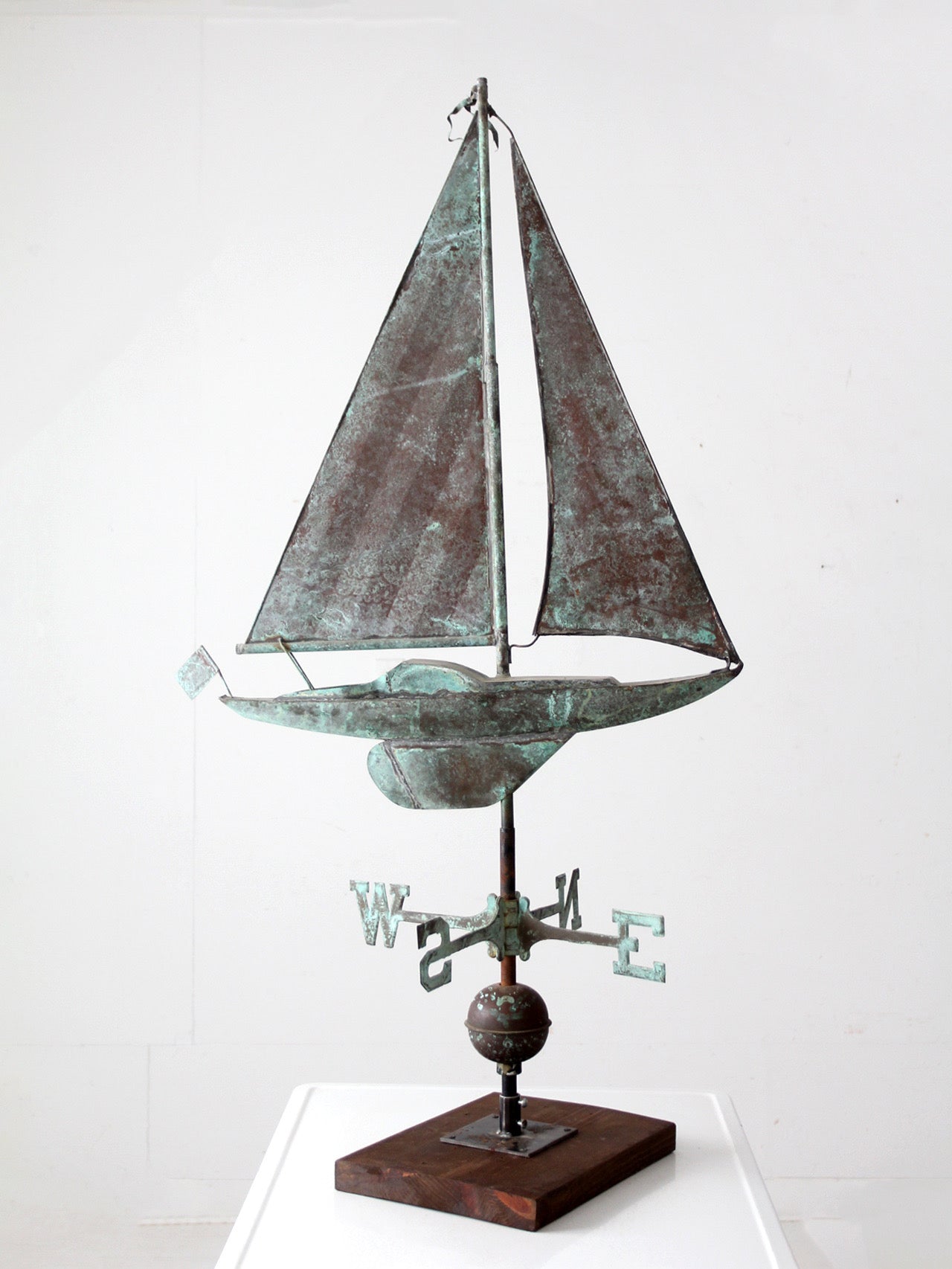 antique nautical weathervane on stand