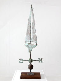 antique nautical weathervane on stand