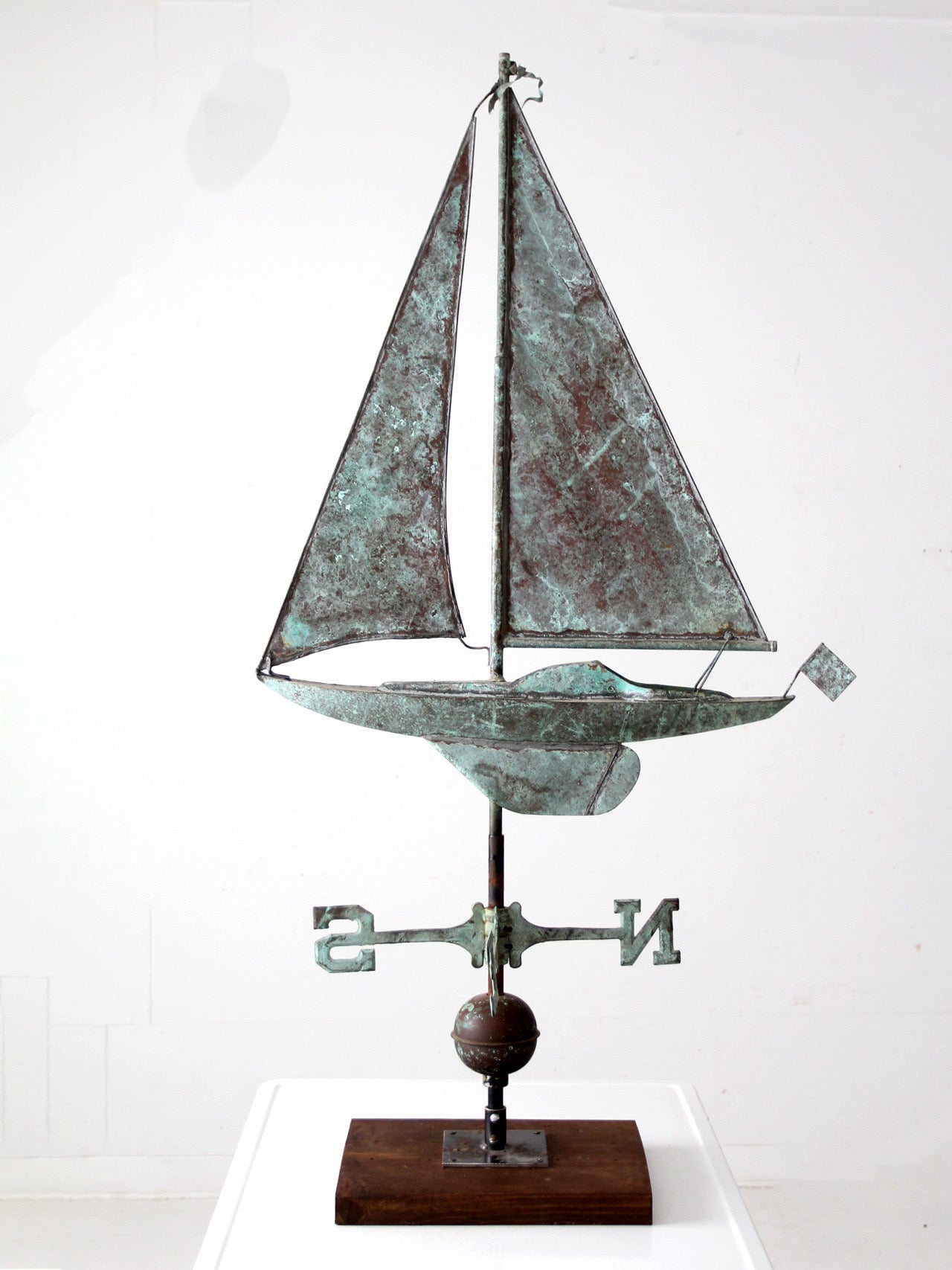 antique nautical weathervane on stand