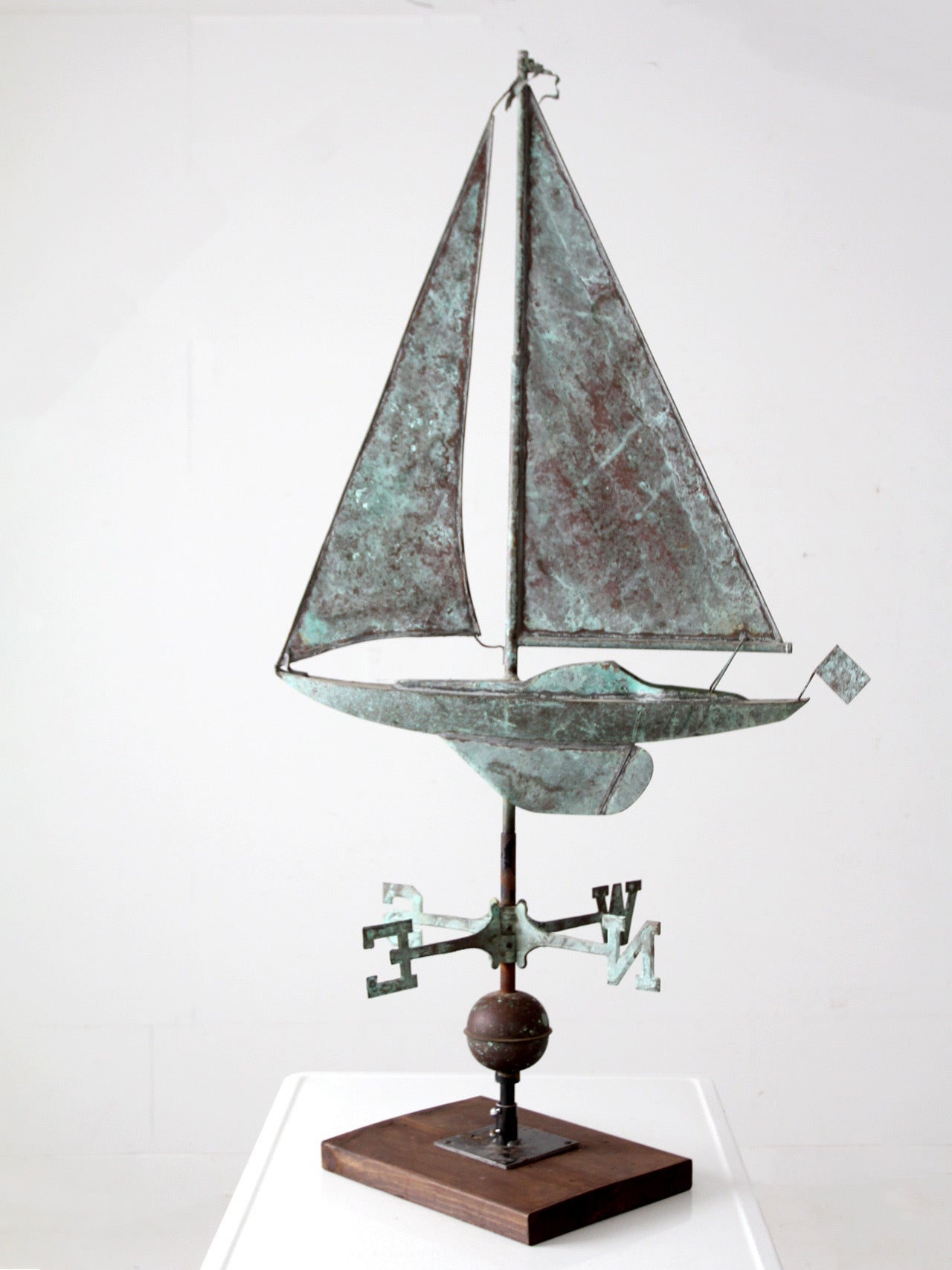 antique nautical weathervane on stand