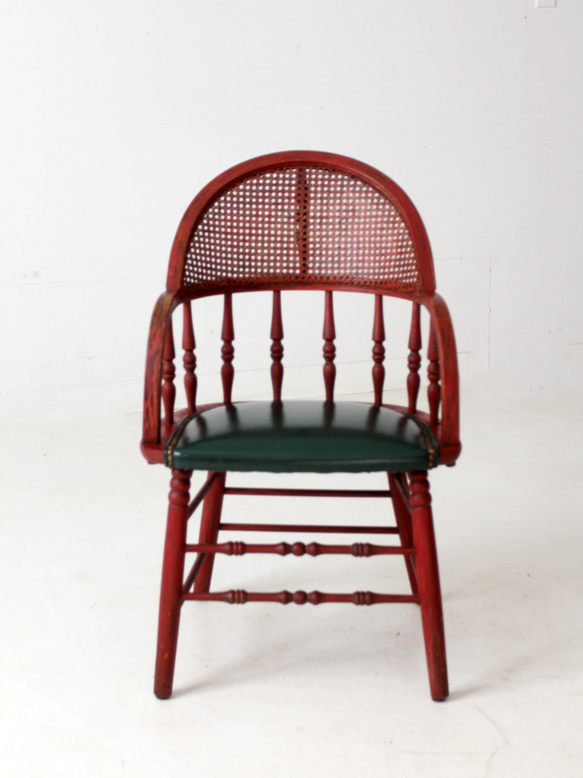 antique red Windsor cane back arm chair with upholstered seat