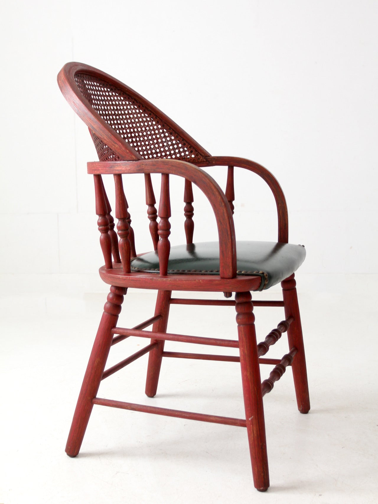 antique red Windsor cane back arm chair with upholstered seat