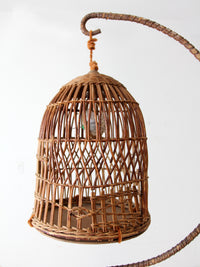 antique wicker bird cage and stand