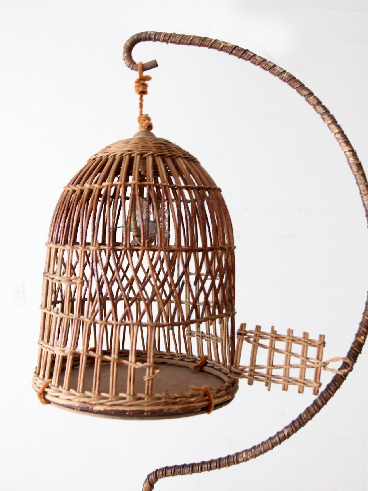 antique wicker bird cage and stand