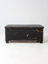 antique black woven canvas trunk