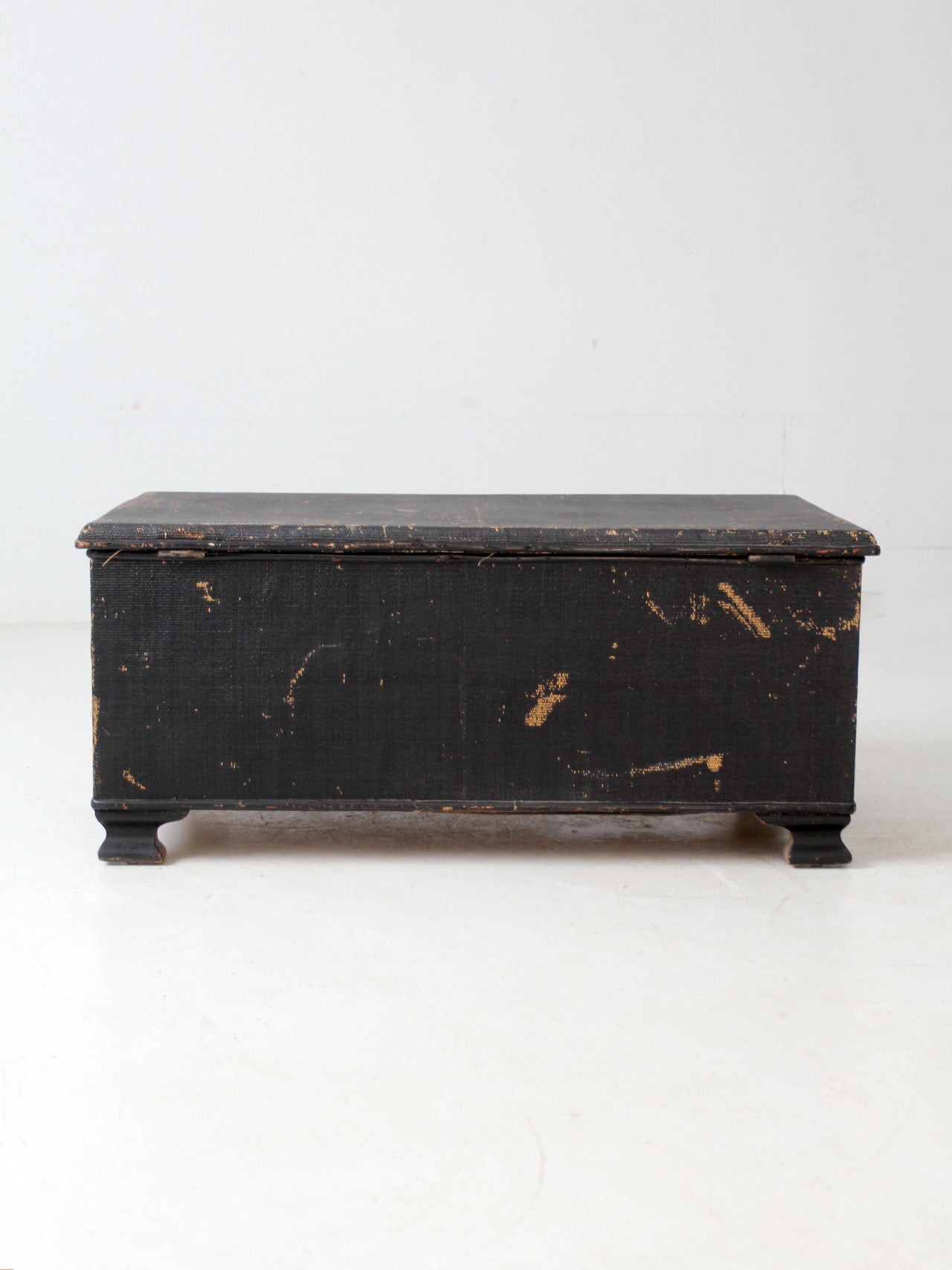 antique black woven canvas trunk
