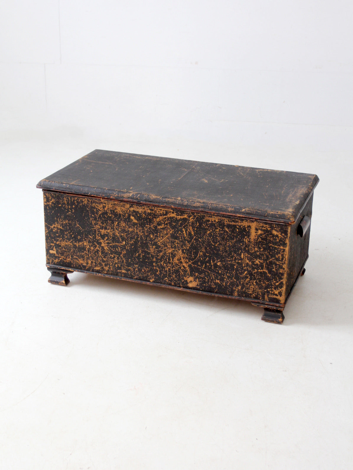 antique black woven canvas trunk