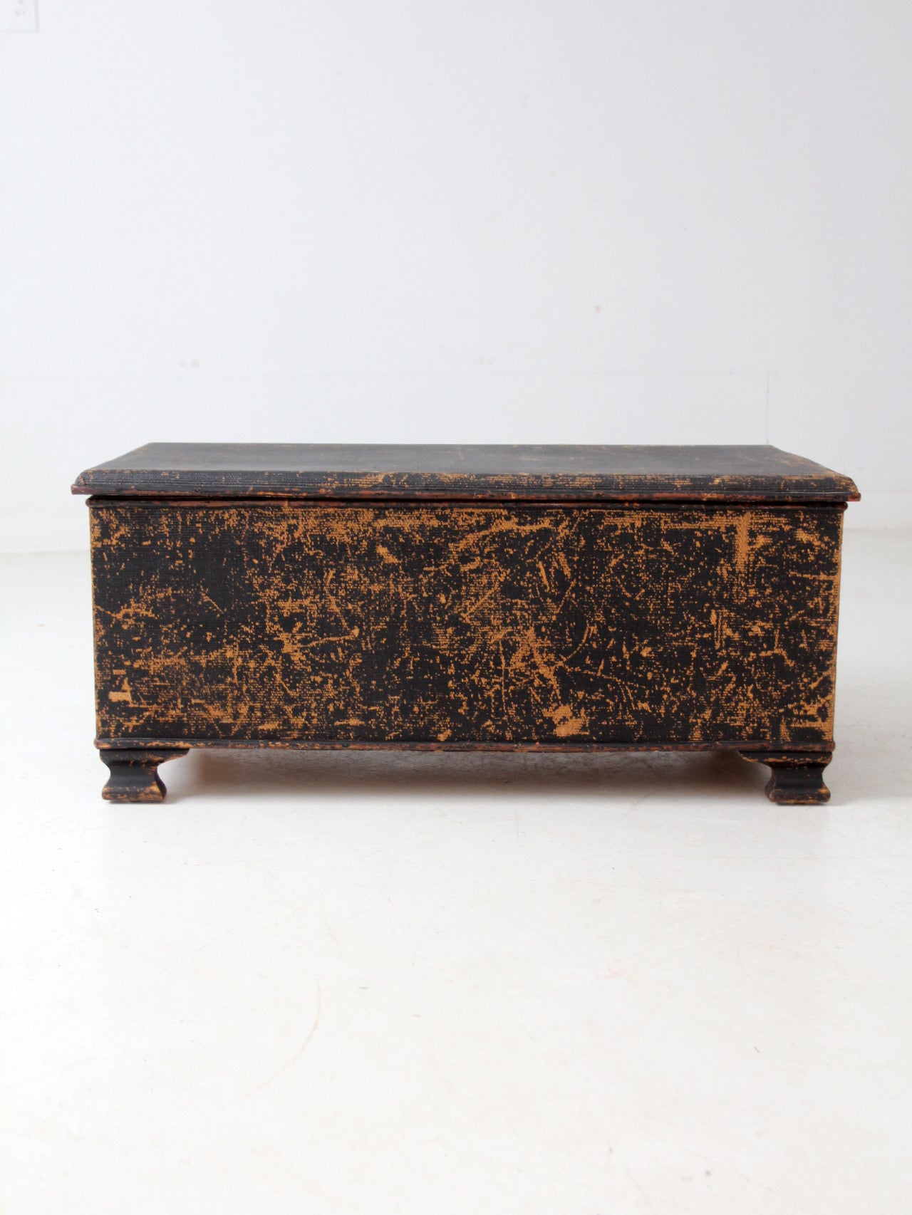 antique black woven canvas trunk