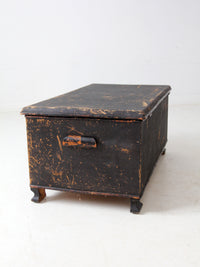 antique black woven canvas trunk