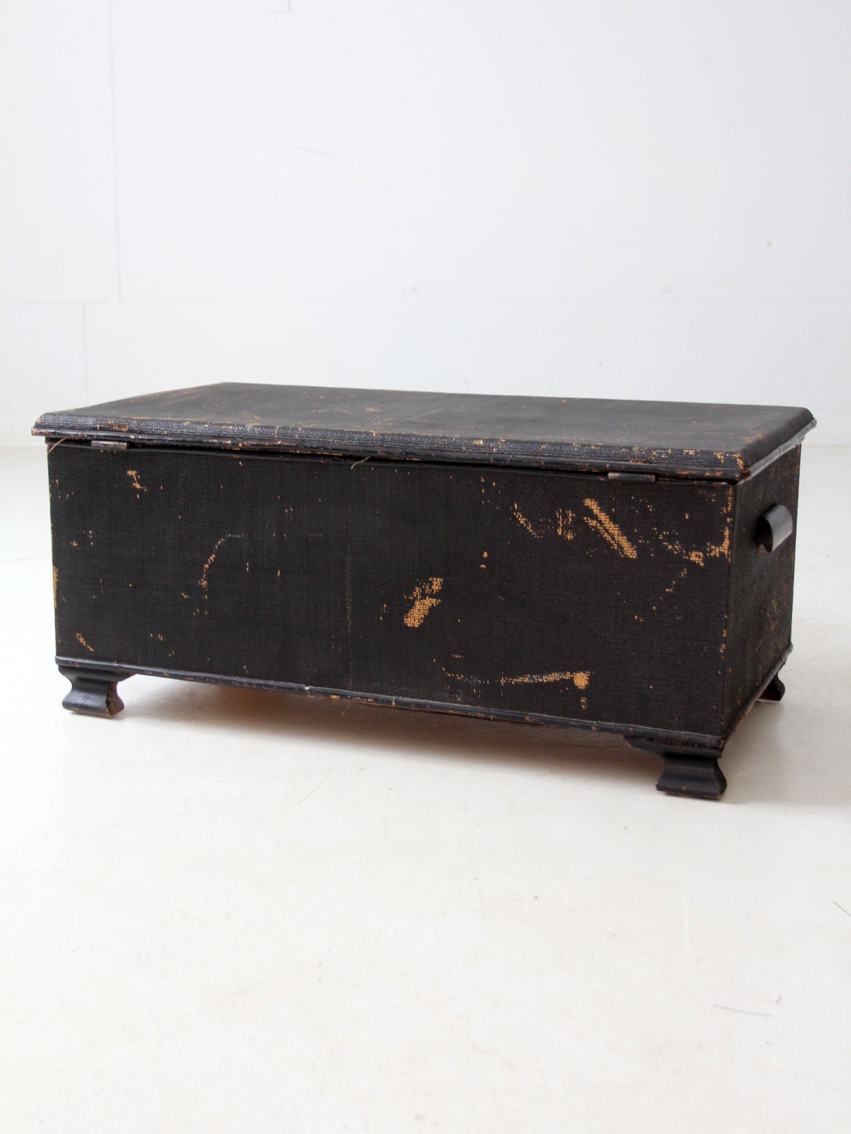 antique black woven canvas trunk