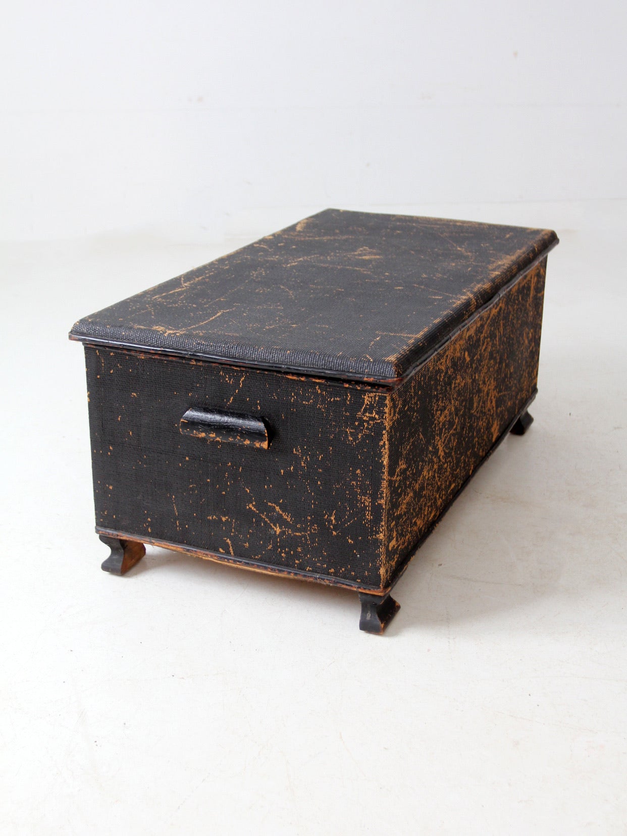 antique black woven canvas trunk