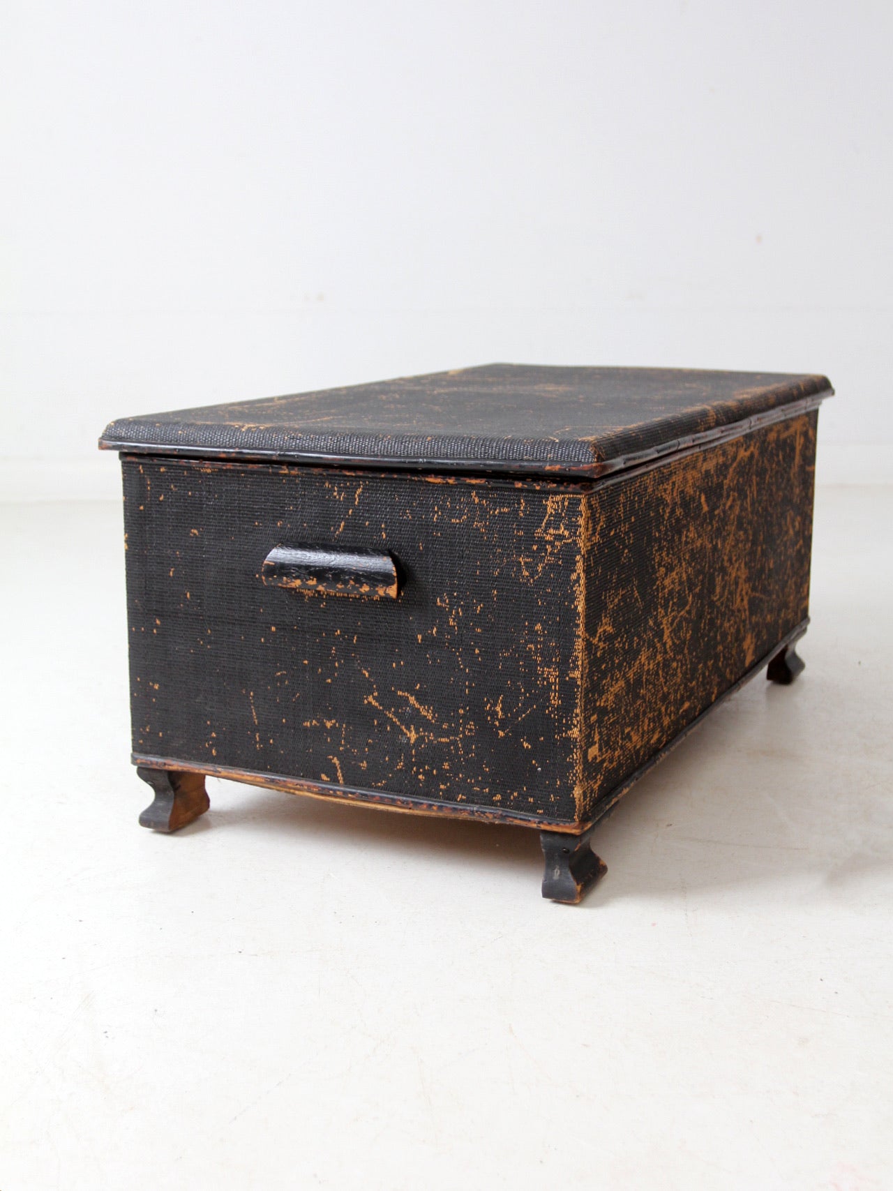 antique black woven canvas trunk