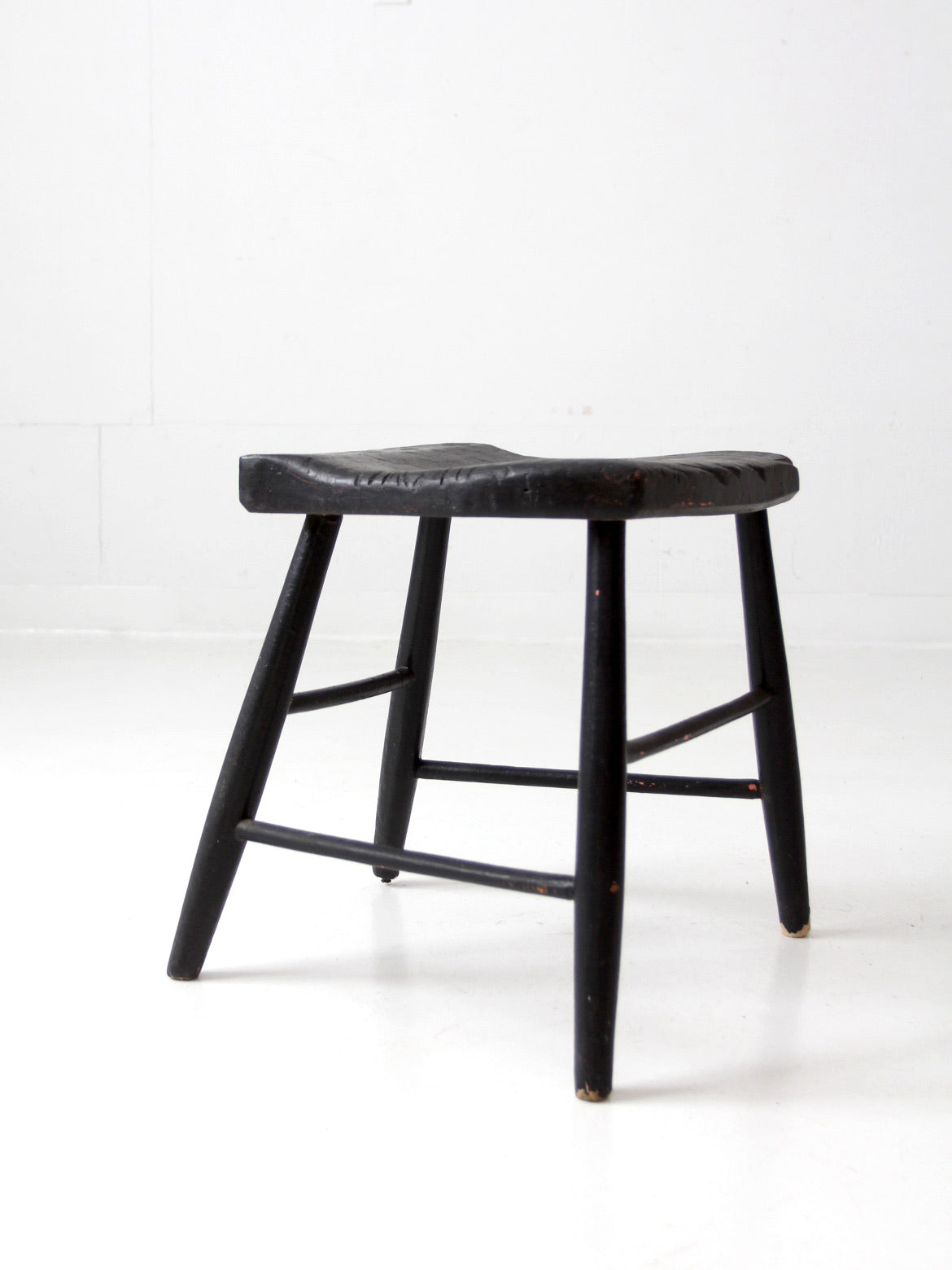 antique black wooden stool