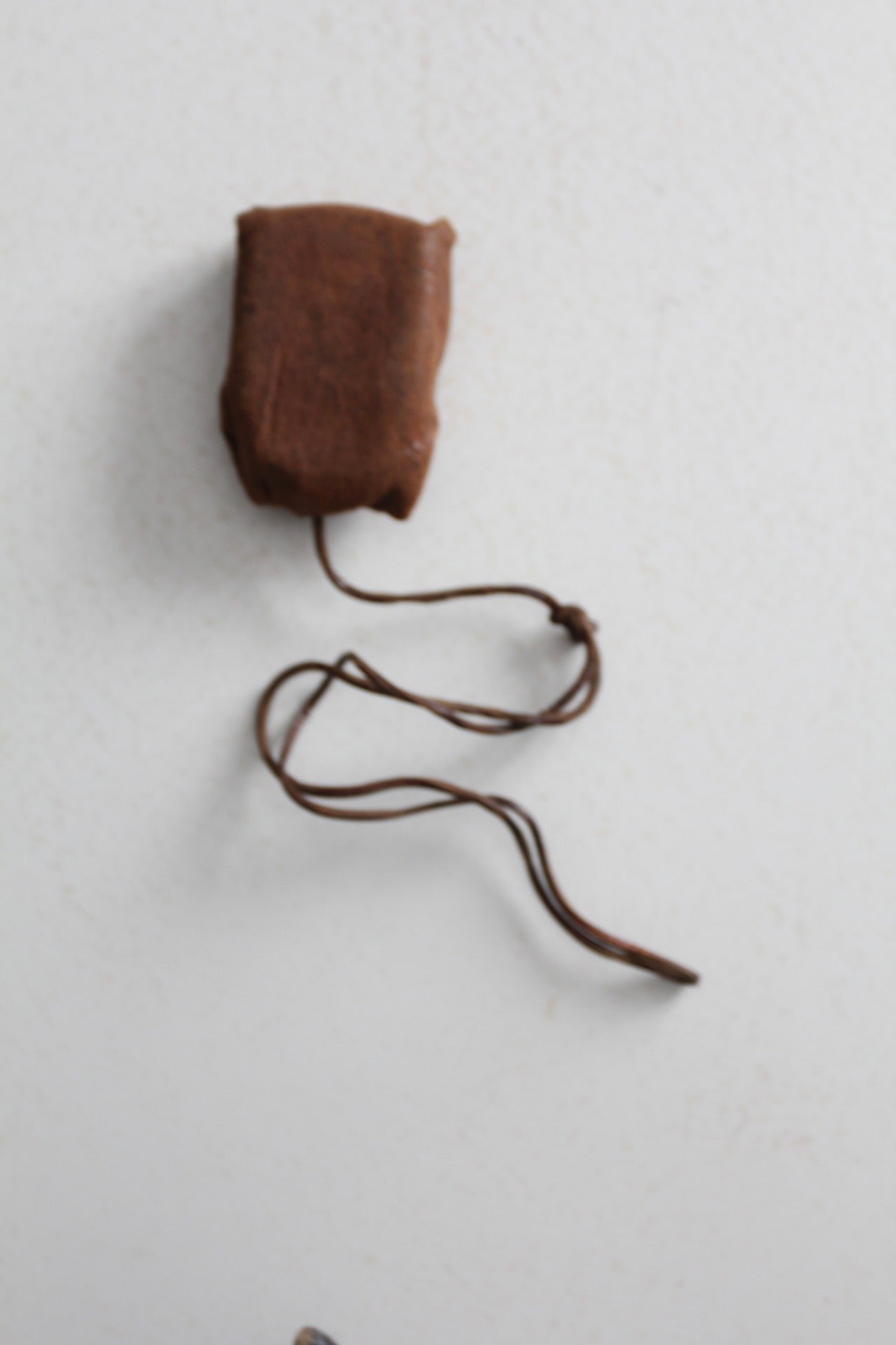 vintage Tower brand gauge with leather pouch