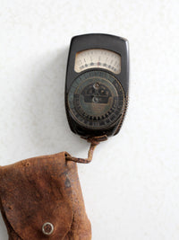 vintage Tower brand gauge with leather pouch