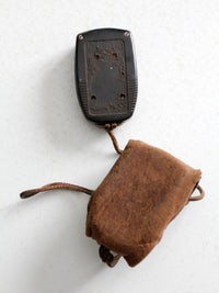 vintage Tower brand gauge with leather pouch