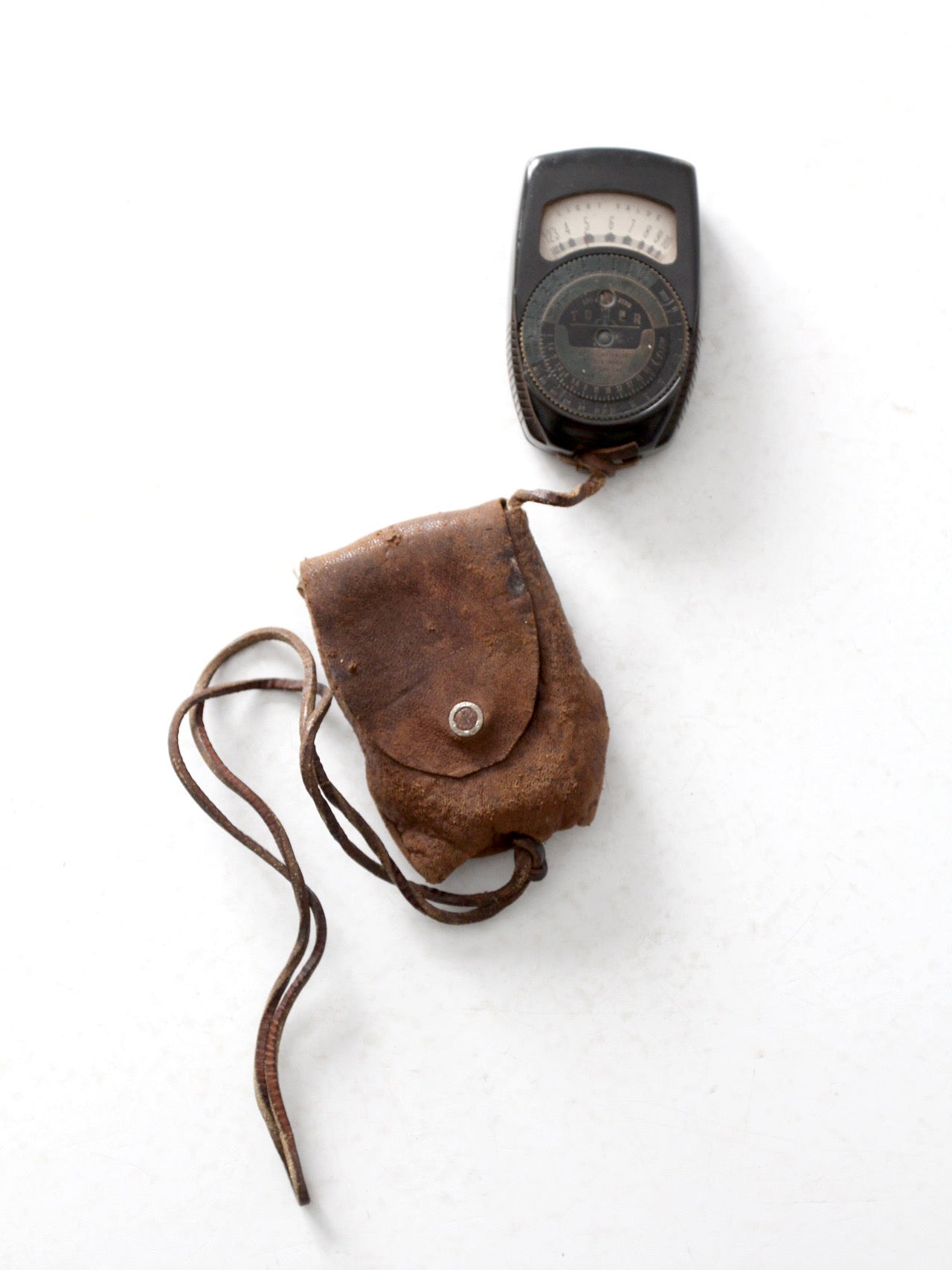 vintage Tower brand gauge with leather pouch