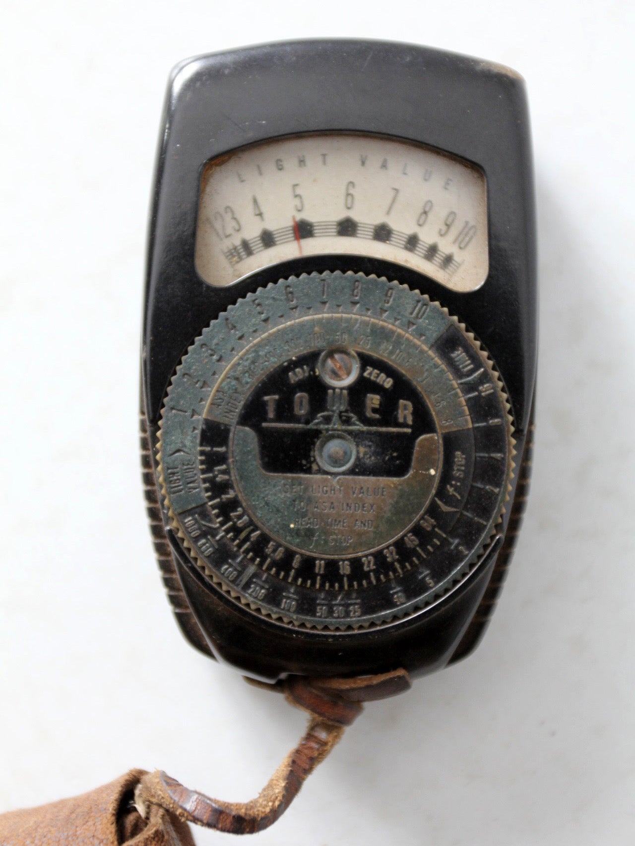 vintage Tower brand gauge with leather pouch