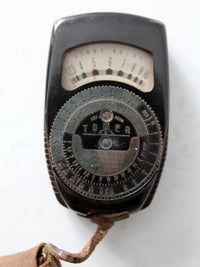 vintage Tower brand gauge with leather pouch