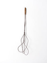 antique rug beater
