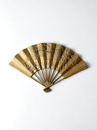 mid-century figurative brass fan wall hanging