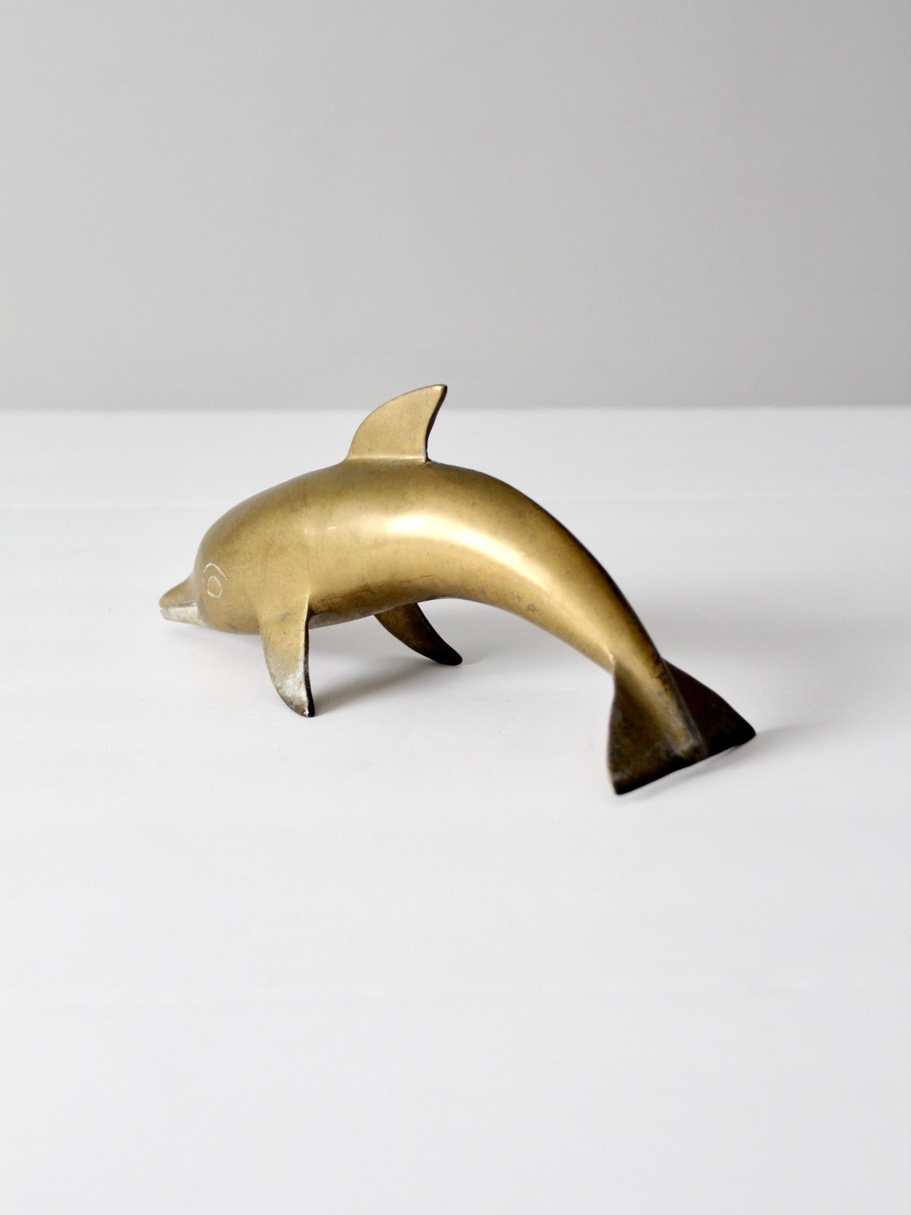 mid-century brass dolphin