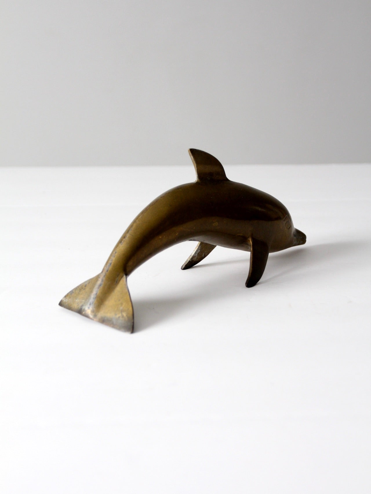mid-century brass dolphin