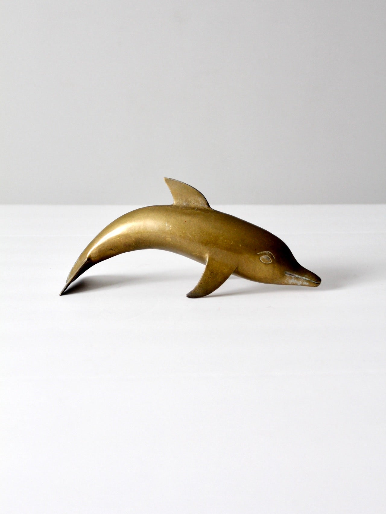 mid-century brass dolphin