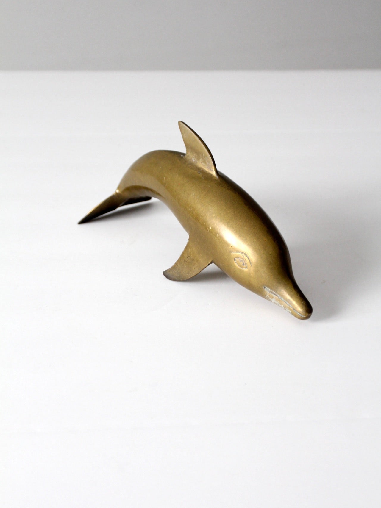 mid-century brass dolphin