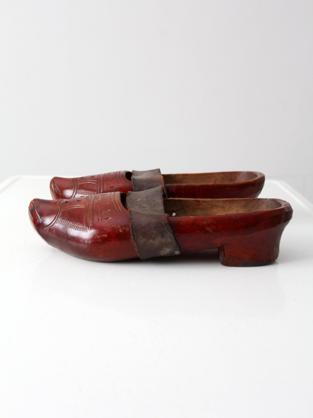 antique carved wood clogs