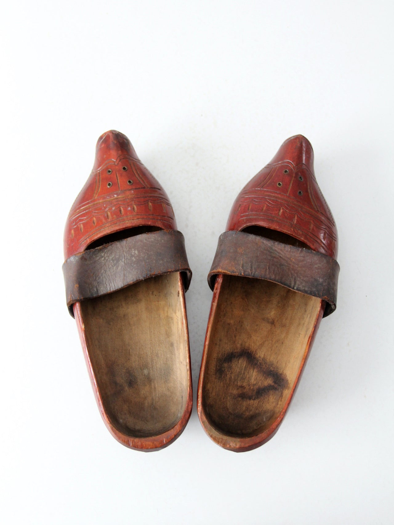 antique carved wood clogs
