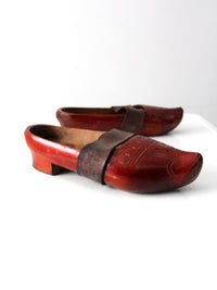 antique carved wood clogs