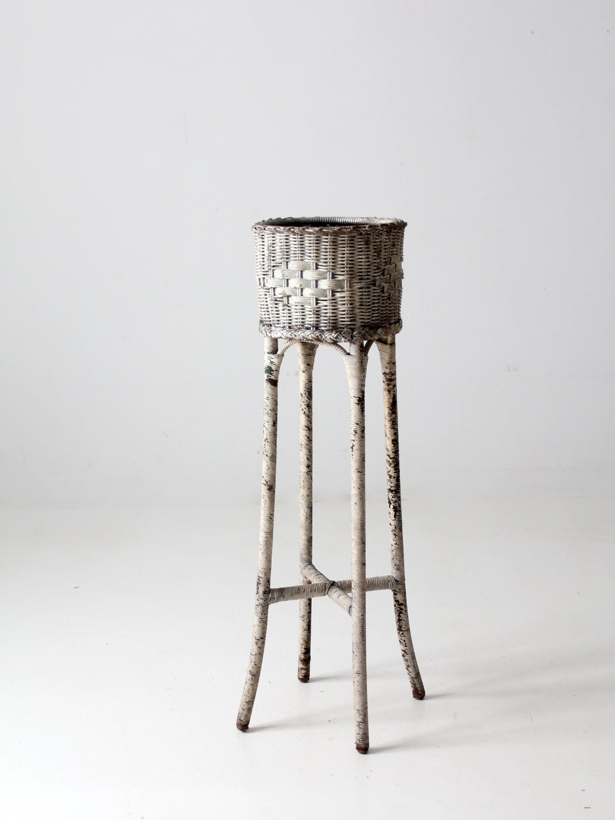 antique white wicker planter