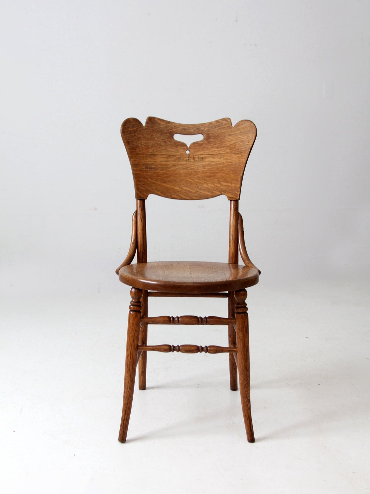 antique bentwood chair with cutout back