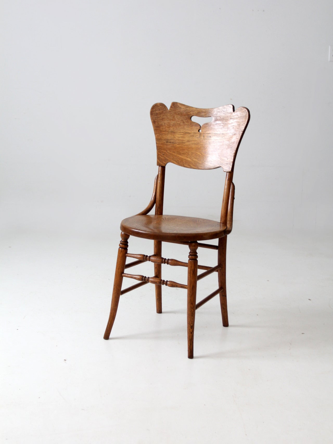 antique bentwood chair with cutout back
