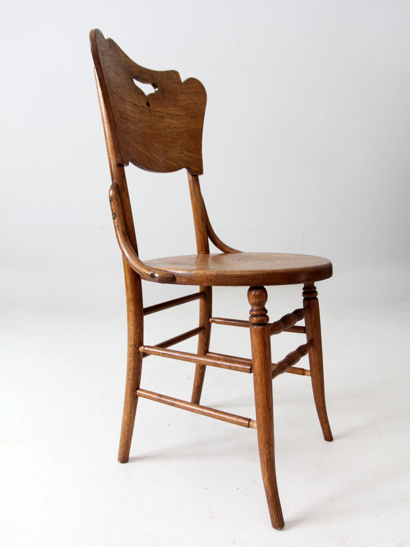 antique bentwood chair with cutout back