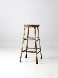 vintage industrial stool with wood seat